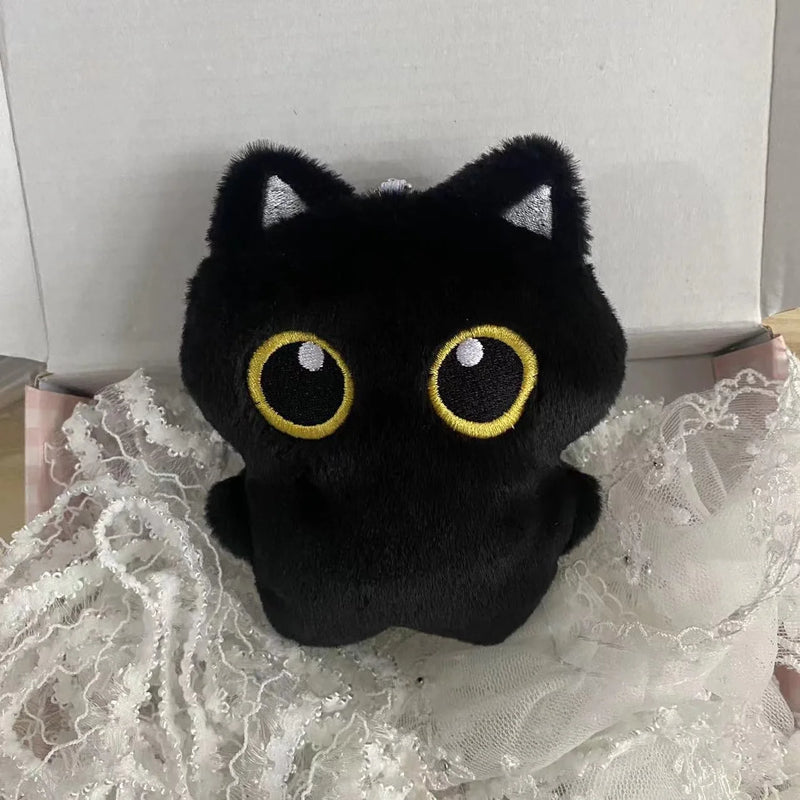 Boneco de pelúcia de gato preto