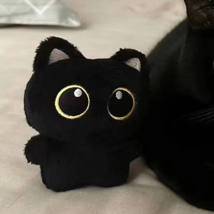 Boneco de pelúcia de gato preto