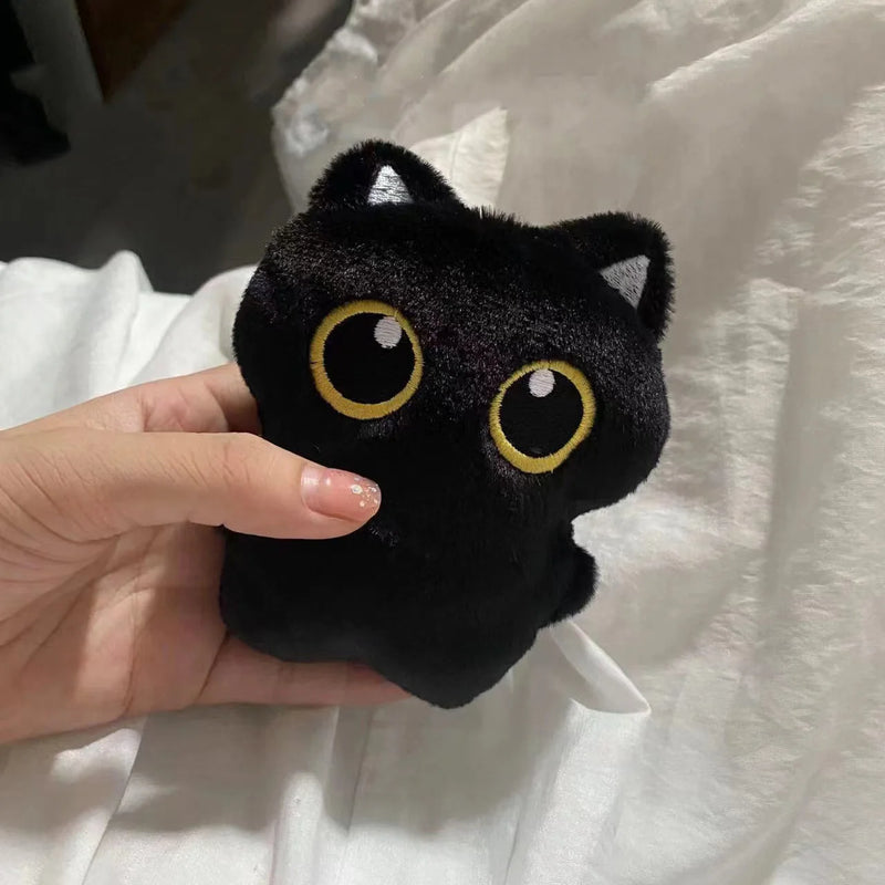 Boneco de pelúcia de gato preto