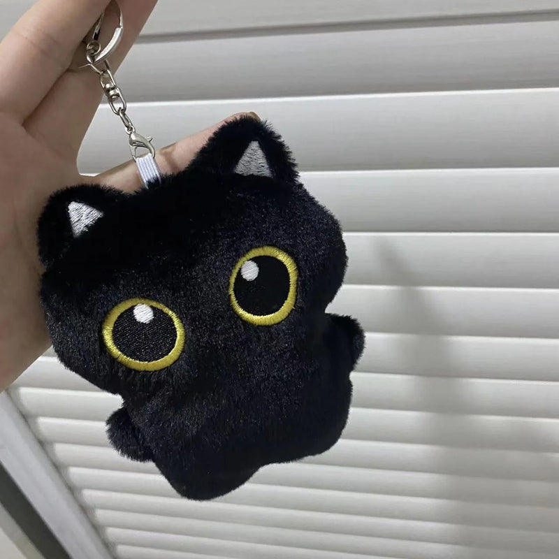 Boneco de pelúcia de gato preto